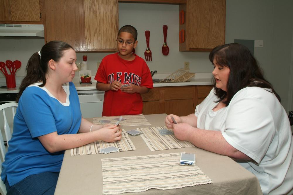 Stephanie Williams with her family in a Carpenter Estates apartment. 