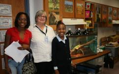 A Greater Heights Academy teacher with students