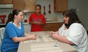 Stephanie Williams with her family in a Carpenter Estates apartment. 